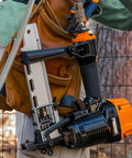 Worker using Pneumatic Fencing Stapler For 10.5 Gauge Staples 1 9 16 Inch Beast Of A Tool With Adjustable Belt Hook and Case