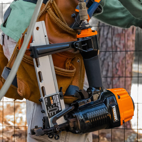 Worker using Pneumatic Fencing Stapler For 10.5 Gauge Staples 1 9 16 Inch Beast Of A Tool With Adjustable Belt Hook and Case
