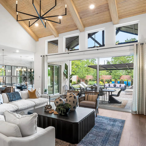 Heavy Duty Extra Long Curtain Rods for Those Huge Windows and Sliding Doors Adjustable From 12 to 20 Feet 1 Inch Thick Metal Brackets Black Drapery Rod for Living Room Patio and Outdoor Spaces visible in a modern living room with large windows and patio doors.