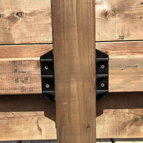 Top Shelf Heavy Duty Privacy Fence Brackets For Standard 2x4 Wood Railings Pre Drilled Galvanized Steel 8 Pack attached to a wood railing.