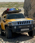 SUV with roof rack carrying luggage over rocky terrain, using Beefy Heavy Duty Roof Rack U Bolt Set 2 Pack Mounting Hardware For Roof Rack And Platform Fits Square Bars 4 To 4.6 In Wide 1.1 To 1.8 In Thick Weather Resistant Iron And Plastic Construction