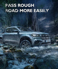 Silver pickup truck driving through rocky stream in forest, highlighting rugged capability