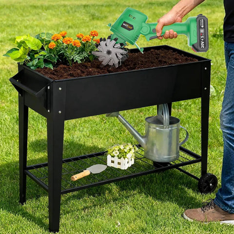Gardener using 20V Cordless Tiller Cultivator with 2x 2.0Ah Batteries and Charger on raised garden bed.