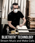 Man wearing WorkTunes Connect Hearing Protector with Bluetooth Audio, AM FM Radio, 24 dB NRR, Built In Microphone, woodworking workshop