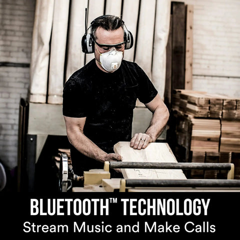 Man wearing WorkTunes Connect Hearing Protector with Bluetooth Audio, AM FM Radio, 24 dB NRR, Built In Microphone, woodworking workshop