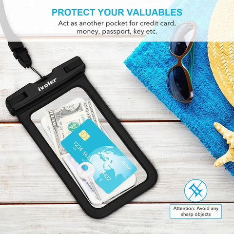 Two Pack Waterproof Fanny Pack And Phone Pouch Dry Bag Set with credit card, cash, and keys on a blue towel by the beach.