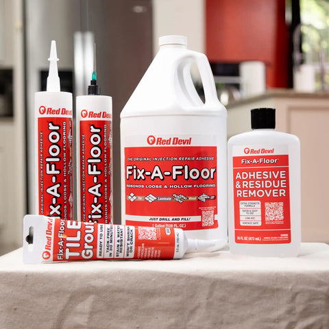 Extra Strength Tile Repair Adhesive Pro Pack with Micro Syringe Injector and Two Drill Bits, bottles and tubes displayed on a table 