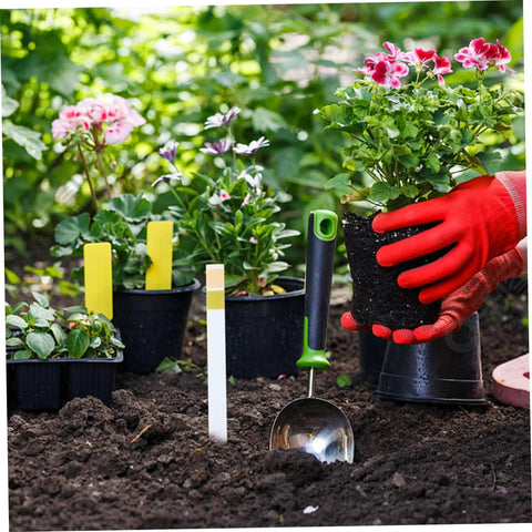 Gardening scene with hand holding potted plant, next to Soil Test Kit with 100 Strips for pH 4.5–9, Easy To Use Test Paper for lawns.