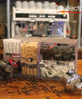 Stackable Cube Organizer With X Divider In Clear Plastic on a counter with coffee supplies, showing linking clips for custom layout.