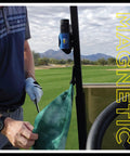 Heavy Duty Magnetic Golf Towel With Top Tier Neodymium Magnet For Carts And Clubs ultra absorbent microfiber towel in use attached to golf cart.