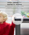 Tot Friendly Corner And Edge Guard Protector Set Includes Sixteen Pre Taped Furniture Bumpers For Tables And Counters Brown protecting table corner with toddler in background.