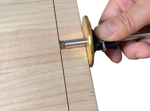 Close-up of Slick Woodworkers Dovetail Marking Gauge With Cam Lever Lock and Interchangeable Blades sharpener on wood for precision scribing.