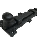 Eight Inch Antique Black Wrought Iron Slide Bolt Door Latch With Top Shelf Durability And Badass Old School Charm For Barn Gates Plus Fence Hardware Includes Mounting Screws, showing side view with knob.