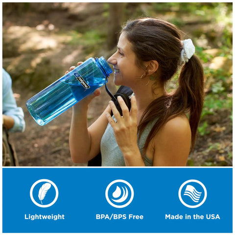 Woman drinking from 48 Oz Wide Mouth Silo Water Bottle BPA Free Durable Leak Proof Large Capacity for Hiking, Gym, and Sports.