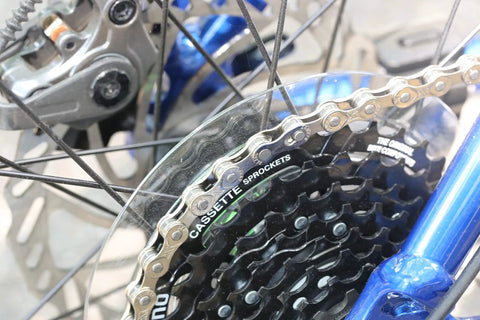 Close-up of 6/7/8 Speed Bike Chain One Half By Three Thirty Second Inch, 116 Links with Quick Link on bike sprocket