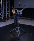 Pro Level Adjustable Snare Drum Stand With Heavy Duty Double Braced Tripod Base For 10 To 14 Inch Pads, featuring a stick holder.