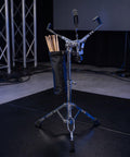Heavy Duty Adjustable Snare Drum Stand With Rock Solid Double Braced Tripod Base And Secure Drumstick Holder made for pro stage rigs.