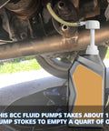 LOZAGU fluid pump on a quart bottle with white head and yellow hose used to transfer transmission fluid under a vehicle.