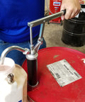 Guardian Lever Action Drum Transfer Pump For 16 To 55 Gallon Drums With 2 Inch Bung And Bushing, 10 Oz Per Stroke, in use