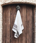Handcrafted Cast Iron Horsehead Wall Hook With A Knockout Rustic Coffee Bean Brown Finish Built Like A Tank For Hanging Coats Keys Hats And Gear Includes Hardware, holding a towel on a wooden door.