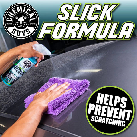 Swift Wipe Waterless Car Wash Spray With High Lubrication Formula, 1 gallon bottle sprayed on a car hood and wiped with a purple microfiber towel