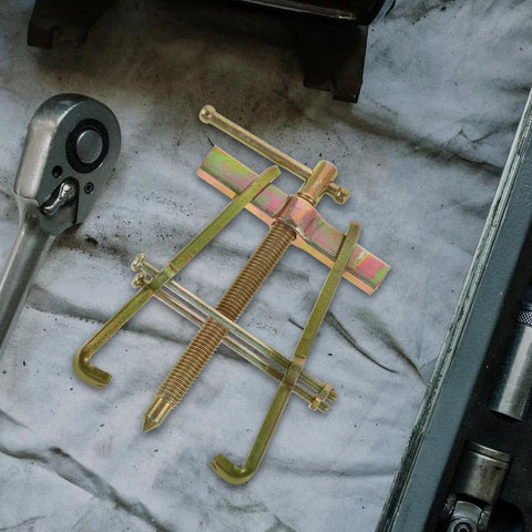 Heavy Duty Carbon Steel Two Jaw Gear Bearing Puller With Reinforced Grips on mechanic workbench for stuck bearing jobs.