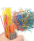 Assorted colorful wires from 840 Piece Breadboard Jumper Wire Kit For Arduino And Prototyping, U Shape Male To Male Jumpers in hand
