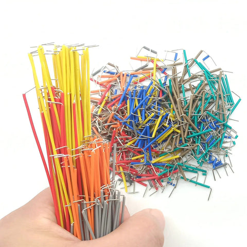 Assorted colorful wires from 840 Piece Breadboard Jumper Wire Kit For Arduino And Prototyping, U Shape Male To Male Jumpers in hand