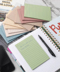 12 Pack Lined Sticky Notes 4x6 Inches With Ruled Sheets in Vintage Colors, shown on desk with notebook and pen, recyclable