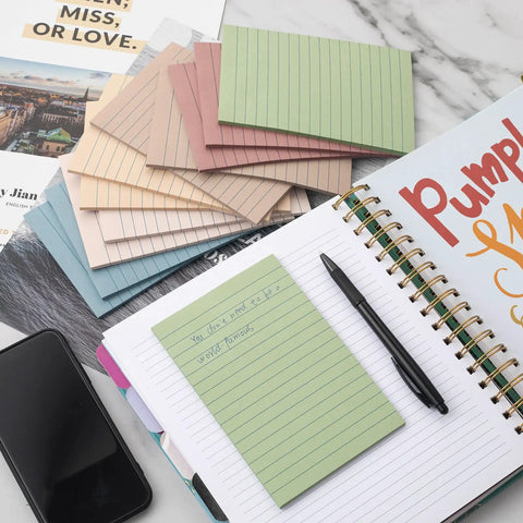 12 Pack Lined Sticky Notes 4x6 Inches With Ruled Sheets in Vintage Colors, shown on desk with notebook and pen, recyclable