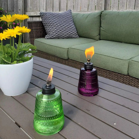 Carnival Glass Tabletop Torches 3 Pack for Patio Backyard and Garden Lighting Portable Glass Flame Torches in Blue and Purple on patio table