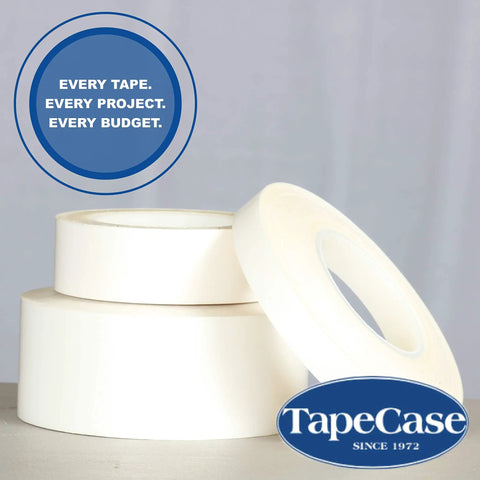 Stacked rolls of translucent tape, featuring Squeak Reduction UHMW Polyethylene Tape With High Tack Acrylic Adhesive For Quiet Durable Performance.