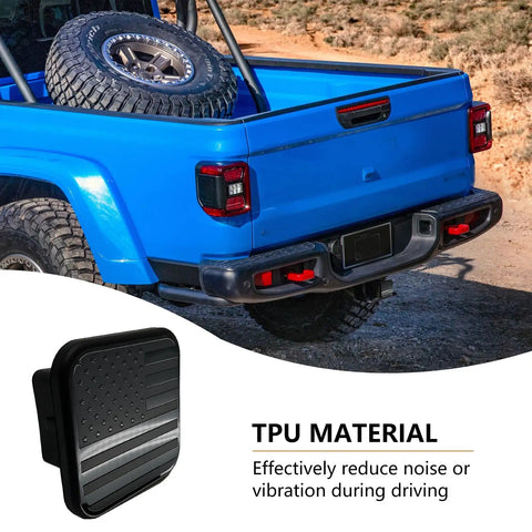 Keep The Crud Out Of Your Rig With This Rugged Square Trailer Hitch Dust Plug Cover on blue truck's hitch, showing American flag design.