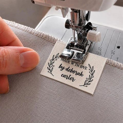 Next Level Custom Cotton Tags Straight Up Premium Fabric Sewing Labels For Quilting Knitting Handmade Clothing Branding Markers Machine Washable Care Instructions 40X50Mm sewn onto fabric with sewing machine.