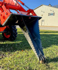 Stump Bucket For Tractors And Skid Steers Up To 105 HP With Bi Directional Ripping Edge attached to tractor, close-up view