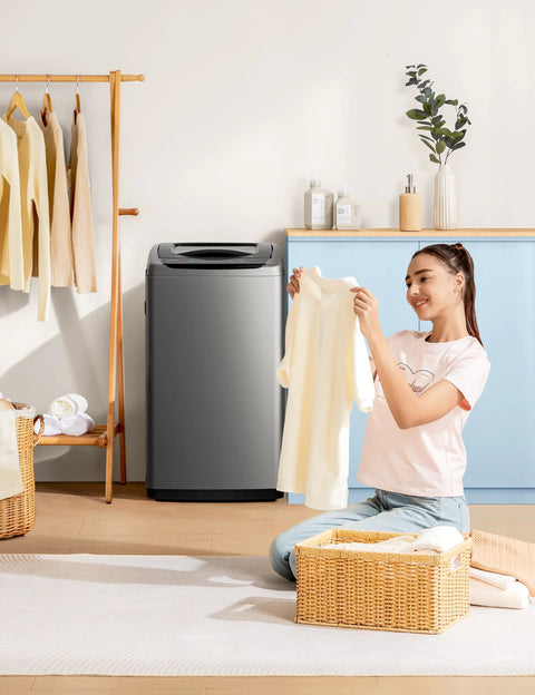 Comfee portable washing machine, 0.9 cu ft gray top-load compact washer in laundry room with woman loading clothes