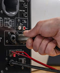 Hand connecting cable to HS4 Black Powered Studio Monitors Pair With 4.5 Inch Woofer And 1 Inch Dome Tweeter 60 Hz To 22 kHz 26W