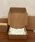 Heavy Duty 20 Pack Of 10X10X3 Inch Brown Corrugated Cardboard Shipping Boxes With Smooth Finish Edges displayed open with packaging.