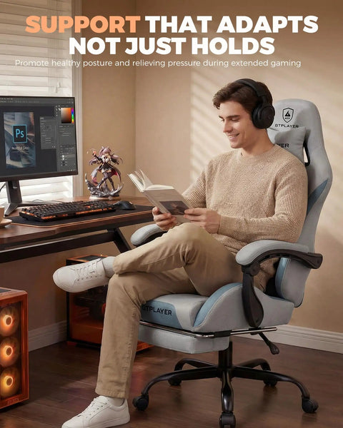 Man sitting in Mist Blue Comfy Gaming Chair With Foot Rest And Pocket Spring Cushion, ergonomic high back, reading book
