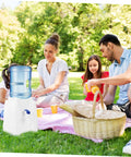 Family picnic with Portable Mini Countertop Water Dispenser For Bottled Water Compact Cold Water Cooler For Home And Office Space Saving Design Easy To Clean Quick Tap Access Ideal Deskside Hydration Station