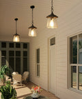 Farmhouse Outdoor Pendant Lights With Painted Black Metal And Clear Bubbled Glass Globes Durable Hanging Lantern For Gazebo Entry Yard Porch Rustic Exterior Lighting Easy Installation displayed on porch