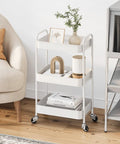 Three Tier Rolling Cart Metal Utility Storage Organizer With Lockable Wheels Space Saving Design Ideal For Kitchen Bathroom Office Nursery Craft Room 33 Lbs Per Shelf Tool Free Assembly In Under Five Minutes White in a living room setting with decorative items on shelves