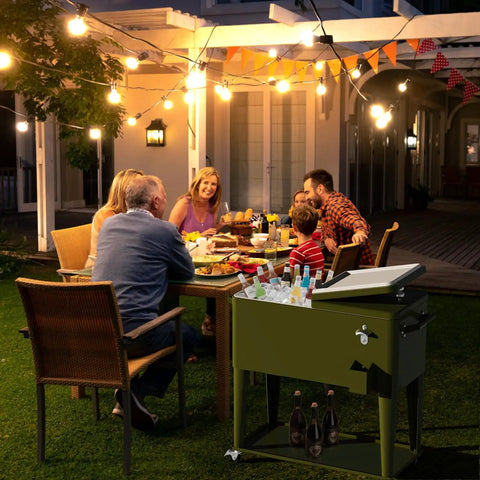 80 Quart Rolling Cooler On Wheels For Outdoor Patio Parties And Bar Events With Bottle Opener Drain Plug And Built In Shelf in use at evening party