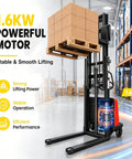 Heavy Hitting Electric Walkie Pallet Stacker With Strong 1.6 Kw Motor Plus Steel Frame Boasting Two Thousand Two Hundred Four Pound Capacity And Ninety Eight Inch Lift Height For Dock To Rack Yard Work with stacked boxes in a warehouse.