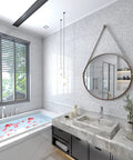 Modern bathroom with white glossy marble contact paper for countertops and cabinets, round mirror, and floral bathtub view