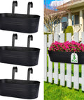 Three Pack 16 Inch Railing Planter Boxes With Detachable Wide Hooks for 2.7 Inch Railings, displayed on a fence with flowers.