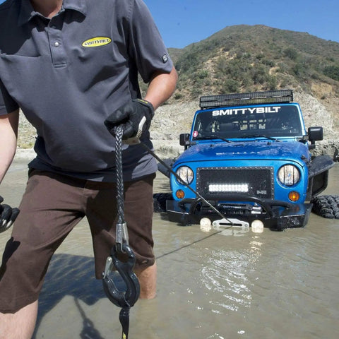 XRC Gen 2 9500lb Winch With Steel Cable For Heavy Duty Off Road Recovery 6.6HP Motor 12 Inch Remote Lead 93.5 Inch Wire Rope 3 Stage Gear Train Rugged All Terrain Beast For Jeeps And Trucks, steel cable being used to recover a Jeep in water