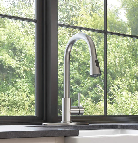 YZZY Single Handle Kitchen Sink Faucet with Pull Down Sprayer Stainless Steel Single Hole Bar Faucet High Arc Chrome Pull Out Kitchen Faucet by a window.