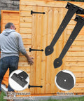 Man installing Two Pack 15 Inch Heavy Duty T Shape Strap Hinges With Screws Black Wrought Iron Spade Tip on wooden shed door.