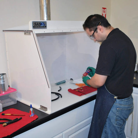 Person using Heavy-Duty 40-Inch Wide Ducted Fume Hood With 6-Inch Exhaust Collar And LED Lighting For Lab Fume Control